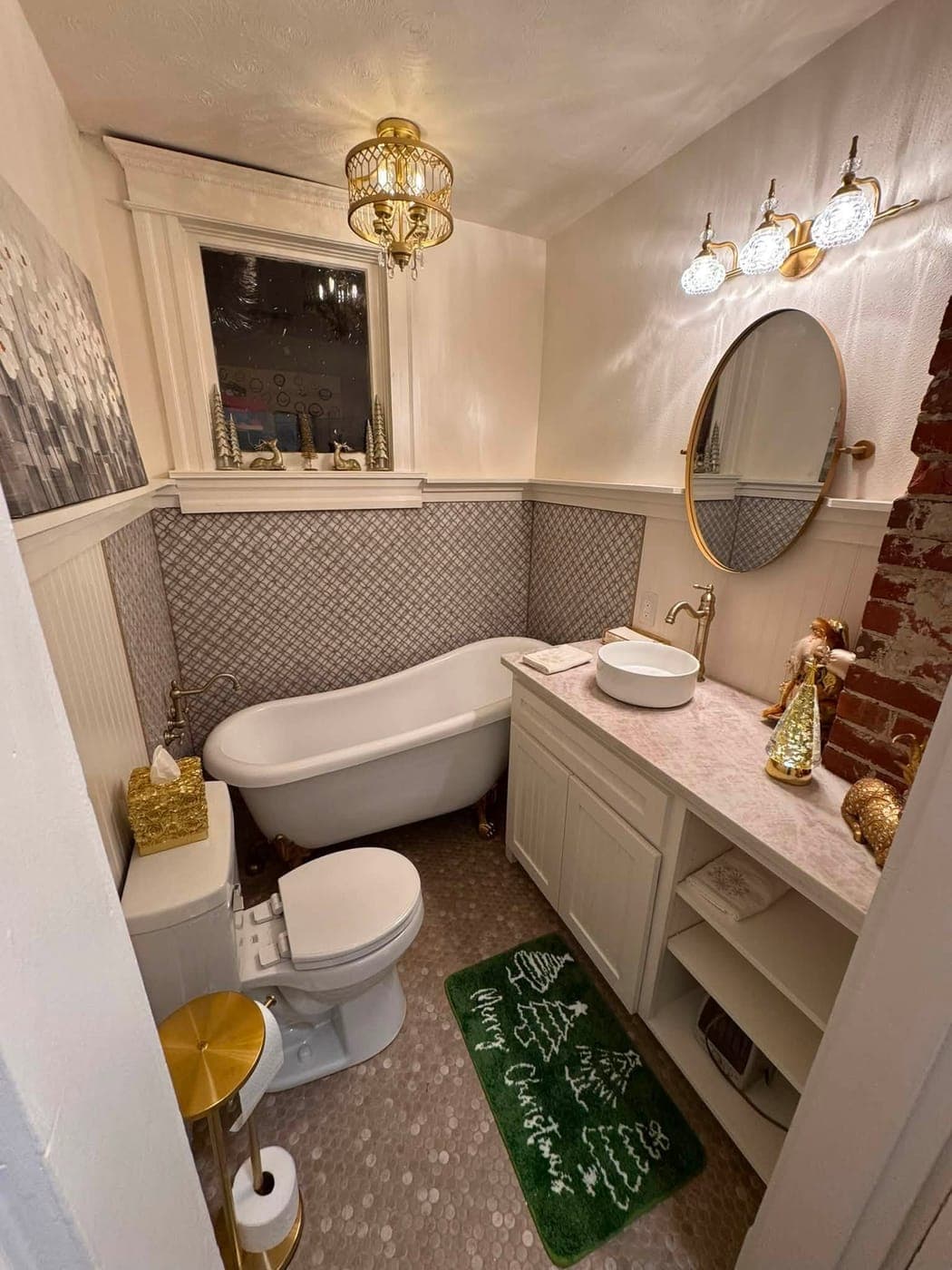Vintage bathroom after remodel — restored clawfoot tub, tile wainscot
